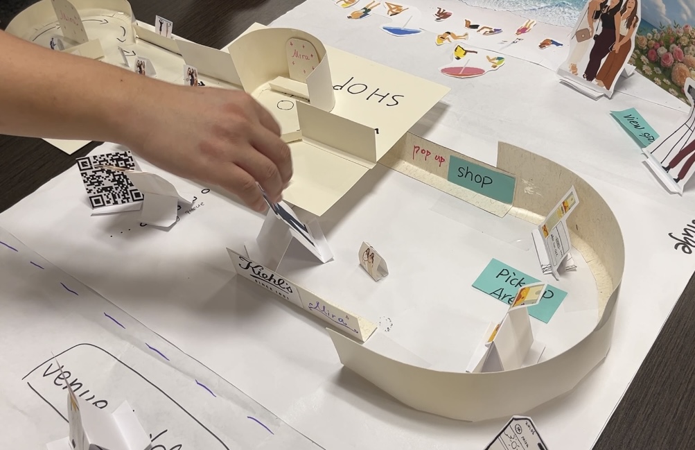 Overhead view of the 1:20 cardboard model showing pop-up stall layout