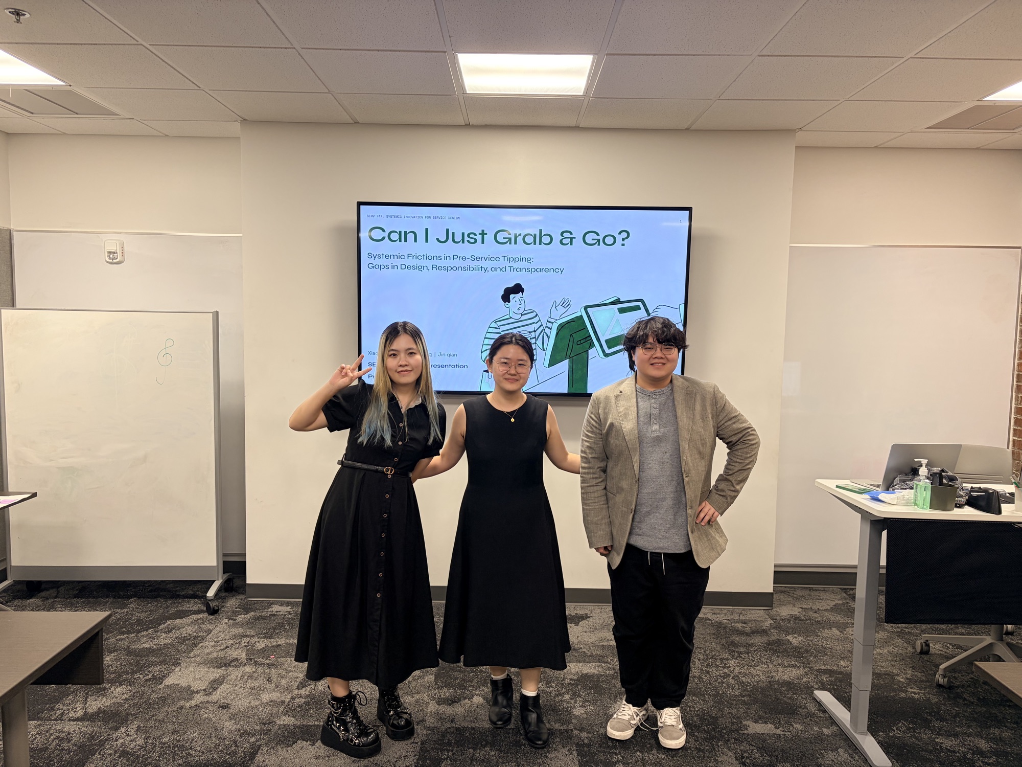 Jin Qian, Xiaoya Huang, and Guo Liang presenting the Tipology project with the title slide on a screen behind them